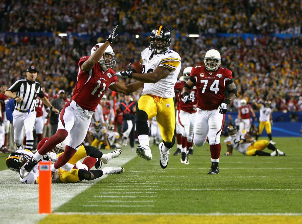 James Harrison of the Pittsburgh Steelers scores a touchdown after running back an interception for 100 yards against the Arizona Cardinals in Super Bowl XLIII. (Photo by Al Bello/Getty Images)