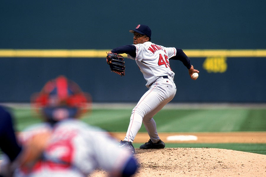 Pedro Martinez of the Boston Red Sox winds back to pitch the ball during a game against the Seattle Mariners at the Safeco Field in Seattle, Washington on Sept. 4, 1999. Martinez struck out 15 in 8 innings as the Red Sox defeated the Mariners 4-0. (Otto Greule Jr./Allsport)