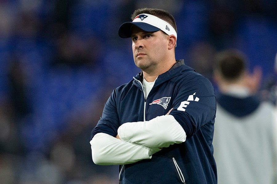 New England Patriots offensive coordinator Josh McDaniels stands on the field during warms up before the game against the Baltimore Ravens at M&T Bank Stadium. (Tommy Gilligan-USA TODAY Sports)