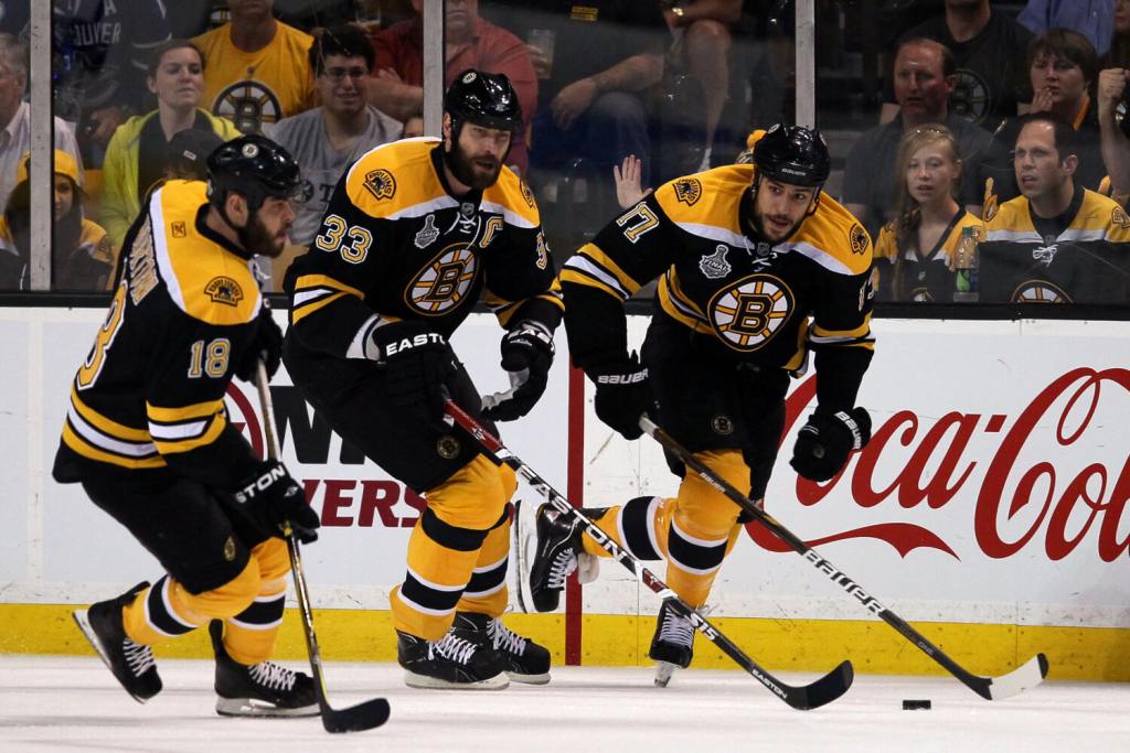 BOSTON, MA - JUNE 06: (L-R) Nathan Horton #18, Zdeno Chara #33 and Milan Lucic #17 of the Boston Bruins skate down the ice during Game Three against the Vancouver Canucks in the 2011 NHL Stanley Cup Final at TD Garden on June 6, 2011 in Boston, Massachusetts. (Photo by Elsa/Getty Images)