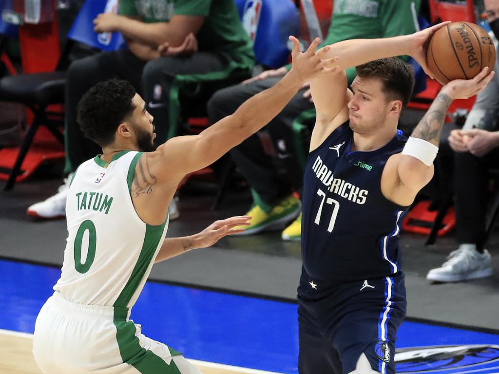 Feb 23, 2021; Dallas, Texas, USA; Dallas Mavericks guard Luka Doncic (77) looks to pass as Boston Celtics forward Jayson Tatum (0) defends during the first quarter at American Airlines Center. Mandatory Credit: Kevin Jairaj-USA TODAY Sports