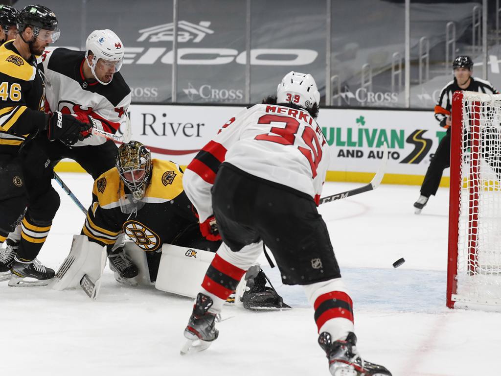 Mar 28, 2021; Boston, Massachusetts, USA; New Jersey Devils right wing Nicholas Merkley (39) miss an empty net behind Boston Bruins goaltender Jaroslav Halak (41) during the second period at TD Garden. Mandatory Credit: Winslow Townson-USA TODAY Sports