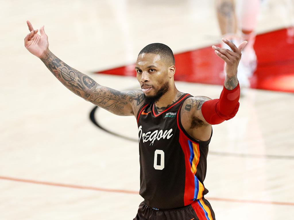 PORTLAND, OREGON - JUNE 03: Damian Lillard #0 of the Portland Trail Blazers reacts after his three point basket in the second quarter against the Denver Nuggets during Round 1, Game 6 of the 2021 NBA Playoffs at Moda Center on June 03, 2021 in Portland, Oregon. NOTE TO USER: User expressly acknowledges and agrees that, by downloading and or using this photograph, User is consenting to the terms and conditions of the Getty Images License Agreement. (Photo by Steph Chambers/Getty Images)