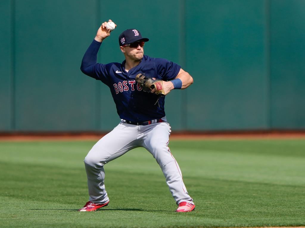 Jul 3, 2021; Oakland, California, USA; Boston Red Sox center fielder Enrique Hernandez (5) throws the ball to first base during the first inning against the Oakland Athletics at RingCentral Coliseum. Mandatory Credit: Stan Szeto-USA TODAY Sports