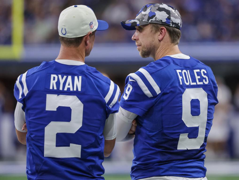 INDIANAPOLIS, IN - AUGUST 27: Matt Ryan #2 and Nick Foles #9 of Indianapolis Colts talk on the sidelines during the second half of a preseason game against the Tampa Bay Buccaneers at Lucas Oil Stadium on August 27, 2022 in Indianapolis, Indiana. (Photo by Michael Hickey/Getty Images)