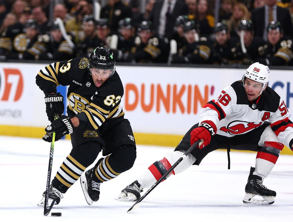 BOSTON, MASSACHUSETTS - JANUARY 15: Erik Haula #56 of the New Jersey Devils defends Brad Marchand #63 of the Boston Bruins during the first period at TD Garden on January 15, 2024 in Boston, Massachusetts. (Photo by Maddie Meyer/Getty Images)