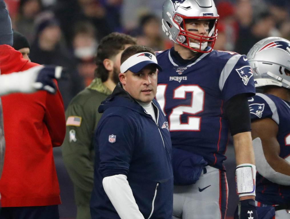 Jan 4, 2020; Foxborough, Massachusetts, USA; New England Patriots quarterback Tom Brady (12) and offensive coordinator Josh McDaniels on the field before their playoff game against the Tennessee Titans at Gillette Stadium. Credit: Winslow Townson-USA TODAY Sports