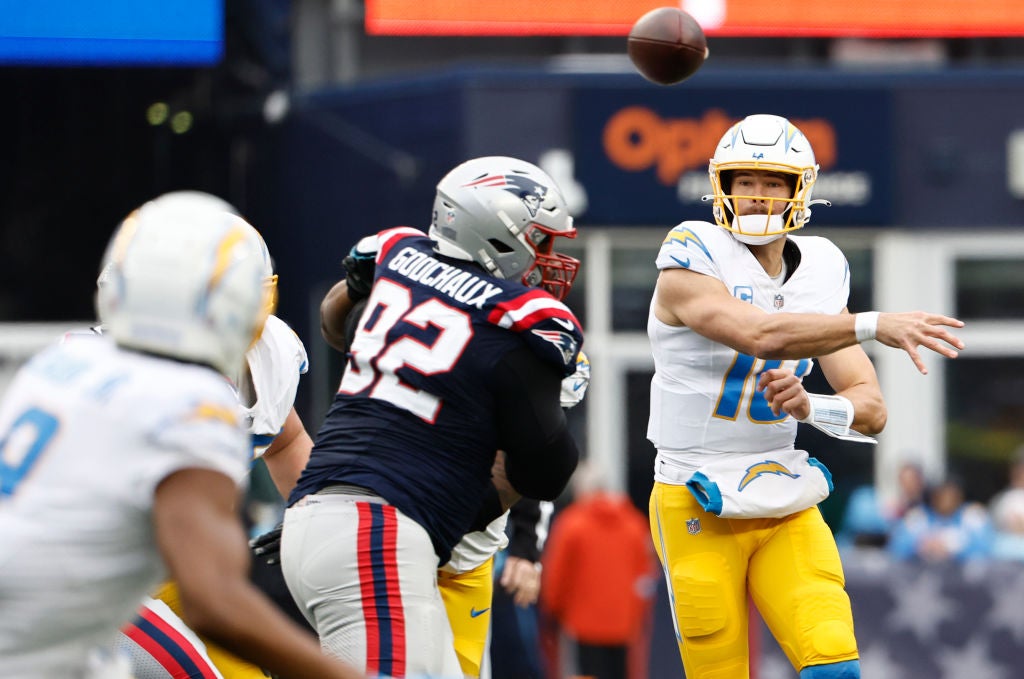 FOXBOROUGH, MASSACHUSETTS - DECEMBER 28: Justin Herbert #10 of the Los Angeles Chargers throws a pass during the first quarter against the New England Patriots at Gillette Stadium on December 28, 2024 in Foxborough, Massachusetts. (Photo by Winslow Townson/Getty Images)