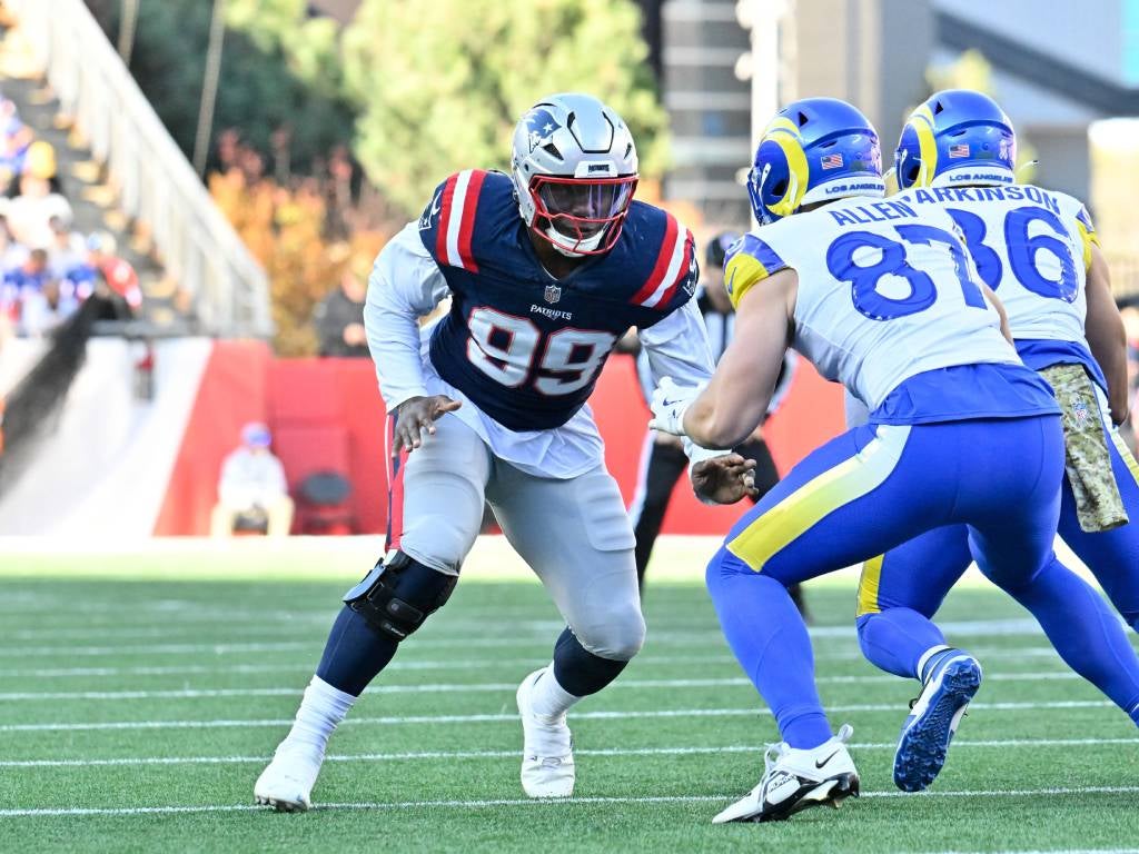 Nov 17, 2024; Foxborough, Massachusetts, USA; New England Patriots defensive end Keion White (99) blocking Los Angeles Rams tight end Davis Allen (87) during the first half at Gillette Stadium. Mandatory Credit: Eric Canha-Imagn Images