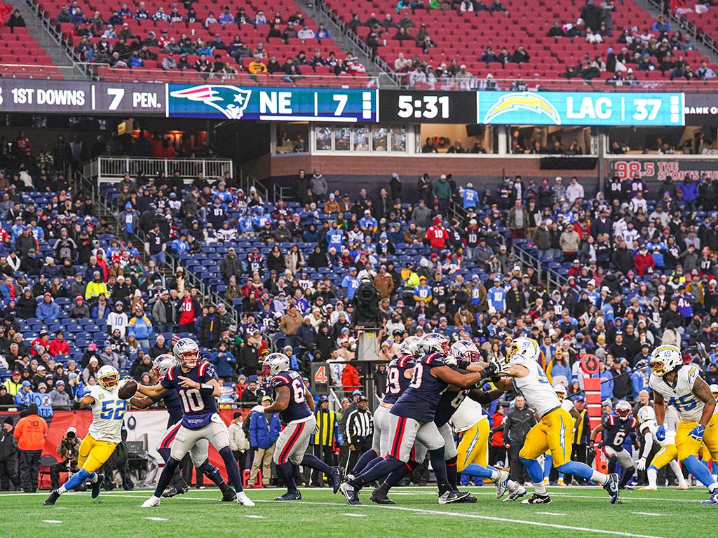 Dec 28, 2024; Foxborough, Massachusetts, USA; New England Patriots quarterback Drake Maye (10) passes the ball against the Los Angeles Chargers in the second half at Gillette Stadium. Mandatory Credit: David Butler II-Imagn Images