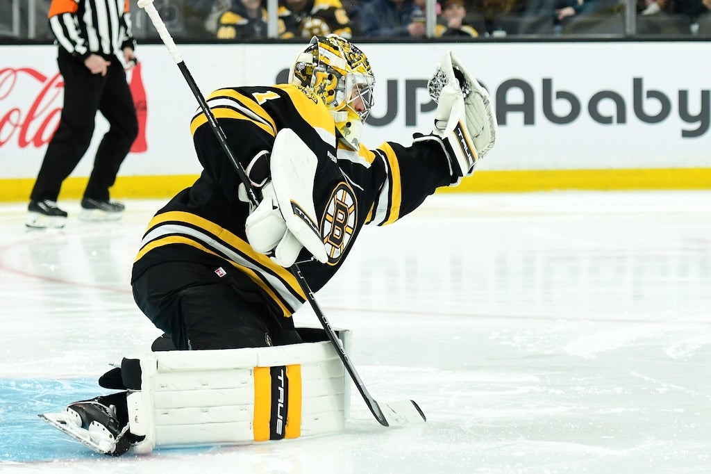 Dec 28, 2024; Boston, Massachusetts, USA; Boston Bruins goaltender Jeremy Swayman (1) makes a glove save during the second period against the Columbus Blue Jackets at TD Garden. Mandatory Credit: Bob DeChiara-Imagn Images