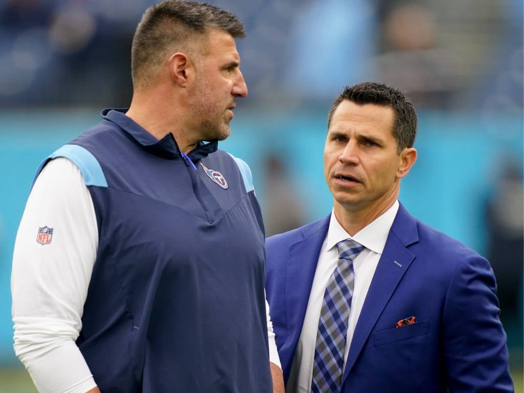 Dec 11, 2022; Nashville, Tennessee, USA; Tennessee Titans head coach Mike Vrabel, left, and interim general manager Ryan Cowden, right, talk on the field as the team gets ready to face the Jacksonville Jaguars at Nissan Stadium. Mandatory Credit: George Walker IV/The Tennessean-USA TODAY Sports