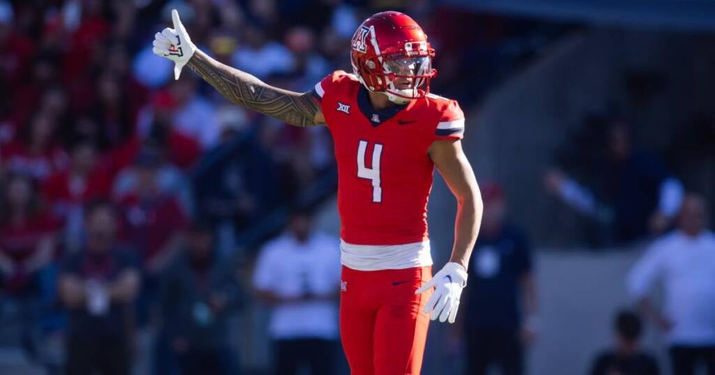 Nov 30, 2024; Tucson, Arizona, USA; Arizona Wildcats wide receiver Tetairoa McMillan (4) against the Arizona State Sun Devils during the Territorial Cup at Arizona Stadium. Mandatory Credit: Mark J. Rebilas-Imagn Images