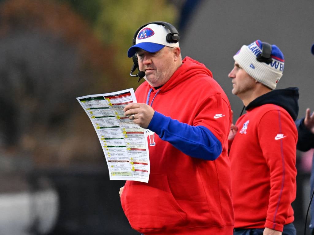 Dec 1, 2024; Foxborough, Massachusetts, USA; New England Patriots offensive coordinator Alex Van Pelt reviews the play card during the second half against the Indianapolis Colts at Gillette Stadium. Mandatory Credit: Eric Canha-Imagn Images