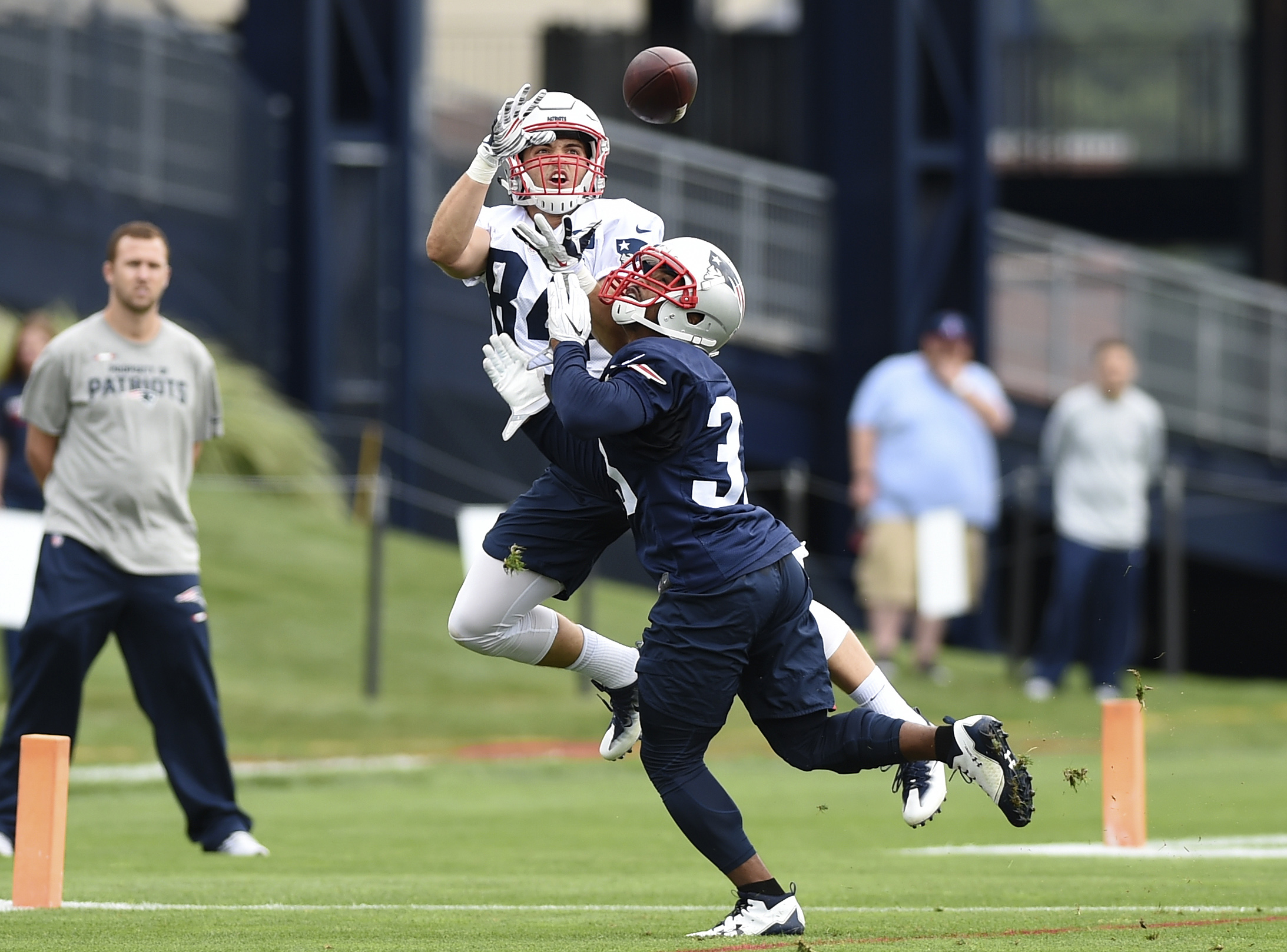 Jul 27, 2017; Foxborough, MA: New England Patriots wide receiver Austin Carr (84) makes a catch while running back Dion Lewis (33) defends during training camp at Gillette Stadium. (Bob DeChiara-USA TODAY Sports)