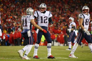 Jan 20, 2019; Kansas City, MO, USA; New England Patriots quarterback Tom Brady (12) celebrates with Patriots wide receiver Julian Edelman (11) during the second half of the AFC Championship game against the Kansas City Chiefs at Arrowhead Stadium. Mandatory Credit: Jay Biggerstaff-USA TODAY Sports