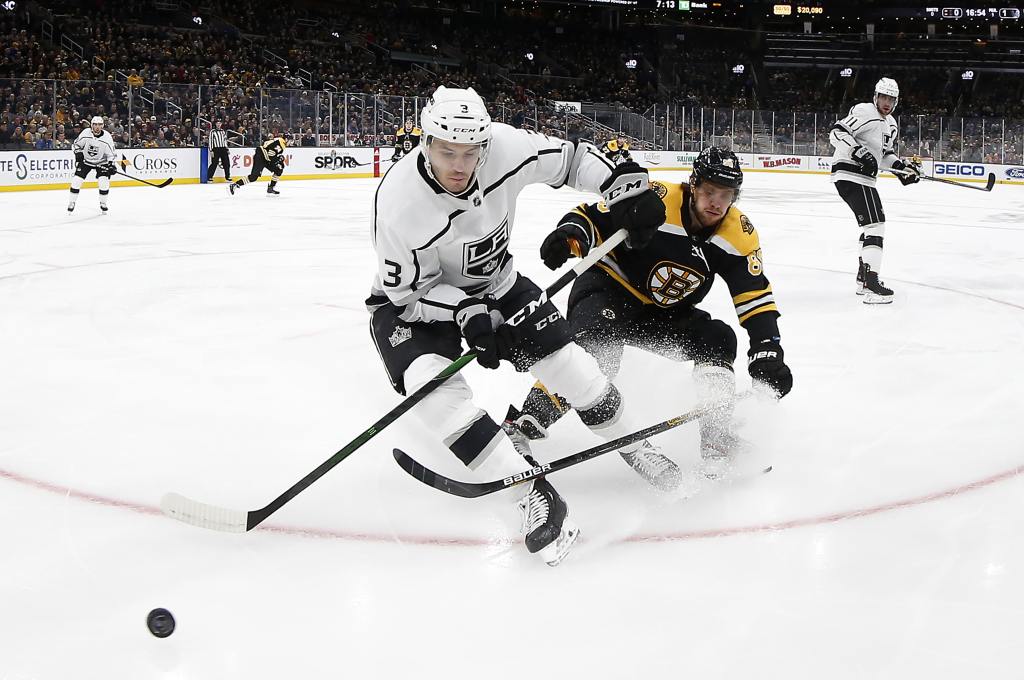 Dec 17, 2019; Boston, MA, USA; Los Angeles Kings defenseman Matt Roy (3) moves the puck away from Boston Bruins right wing David Pastrnak (88) during the first period at TD Garden. Mandatory Credit: Winslow Townson-USA TODAY Sports