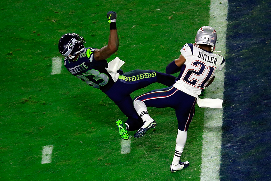 GLENDALE, AZ - FEBRUARY 01: Malcolm Butler #21 of the New England Patriots intercepts a pass by Russell Wilson #3 of the Seattle Seahawks intended for Ricardo Lockette #83 late in the fourth quarter during Super Bowl XLIX at University of Phoenix Stadium on February 1, 2015 in Glendale, Arizona. (Photo by Jamie Squire/Getty Images)