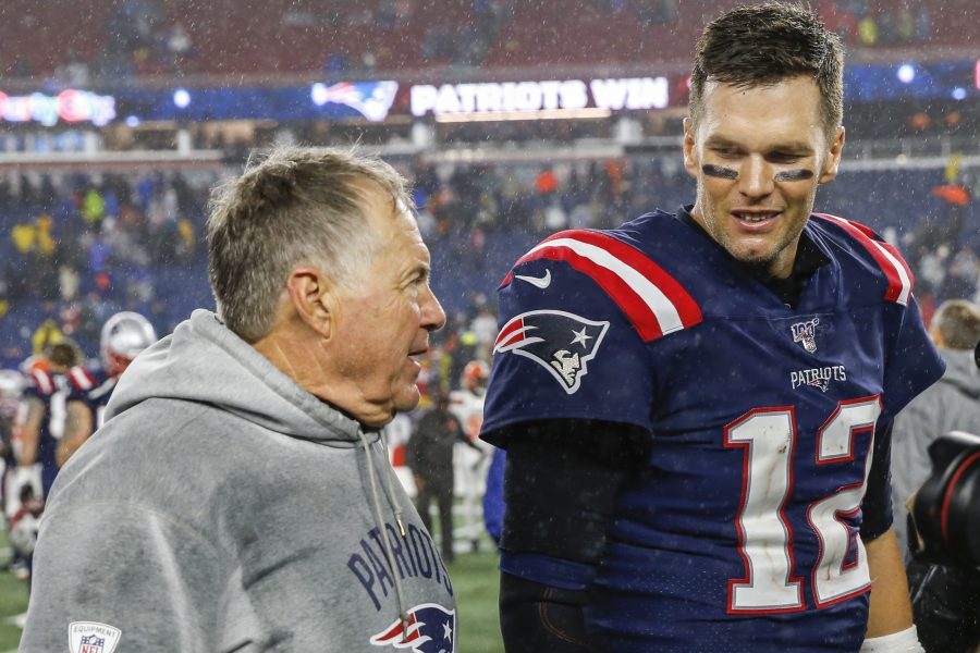 Oct 27, 2019; Foxborough, MA, USA; New England Patriots head coach Bill Belichick with quarterback Tom Brady (12) after defeating the Cleveland Browns at Gillette Stadium. Mandatory Credit: Greg M. Cooper-USA TODAY Sports