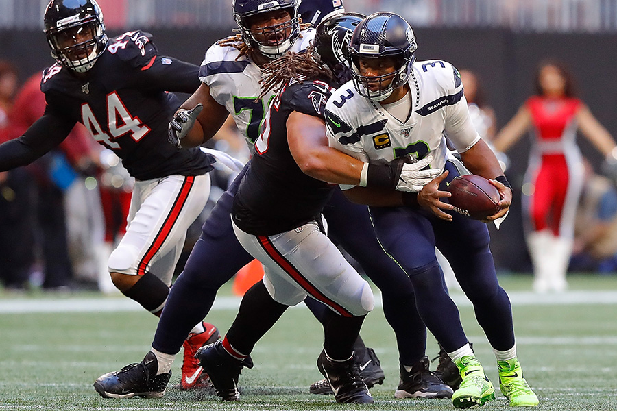ATLANTA, GEORGIA - OCTOBER 27: Russell Wilson #3 of the Seattle Seahawks is sacked by Tyeler Davison #96 of the Atlanta Falcons in the second half at Mercedes-Benz Stadium on October 27, 2019 in Atlanta, Georgia. (Photo by Kevin C. Cox/Getty Images)