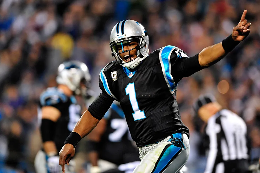 CHARLOTTE, NC - NOVEMBER 18: Cam Newton #1 of the Carolina Panthers celebrates after throwing the game-winning touchdown late in the fourth quarter against the New England Patriots during play at Bank of America Stadium on November 18, 2013 in Charlotte, North Carolina. The Panthers won 24-20. (Photo by Grant Halverson/Getty Images)
