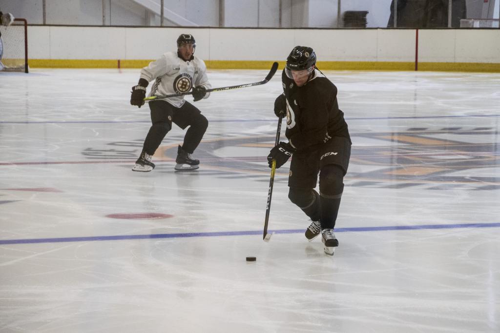 Matt Grzelcyk and Brad Marchand of the Boston Bruins practices at Warrior Ice Arena on July 6, 2020. (Credit: Boston Bruins)