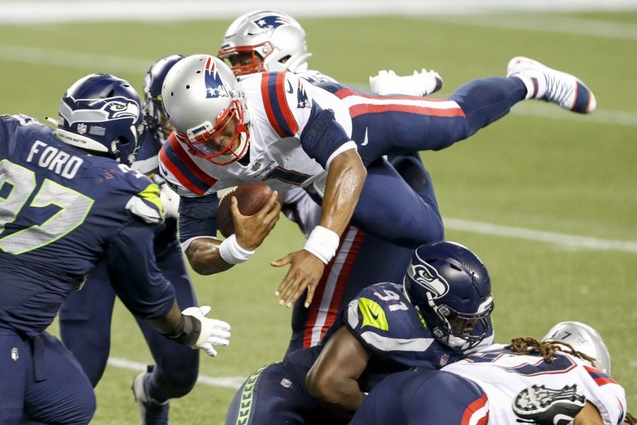 Sep 20, 2020; Seattle, Washington, USA; New England Patriots quarterback Cam Newton (1) is tackled shy of the goal line for the final play of a 35-30 loss against the Seattle Seahawks at CenturyLink Field. Mandatory Credit: Joe Nicholson-USA TODAY Sports