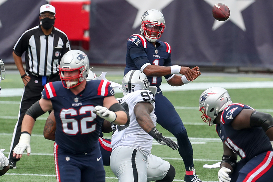 Sep 27, 2020; Foxborough, Massachusetts, USA; New England Patriots quarterback Cam Newton (1) passes the ball to New England Patriots running back Rex Burkhead (34) during the first half against the Las Vegas Raiders at Gillette Stadium. Mandatory Credit: Paul Rutherford-USA TODAY Sports