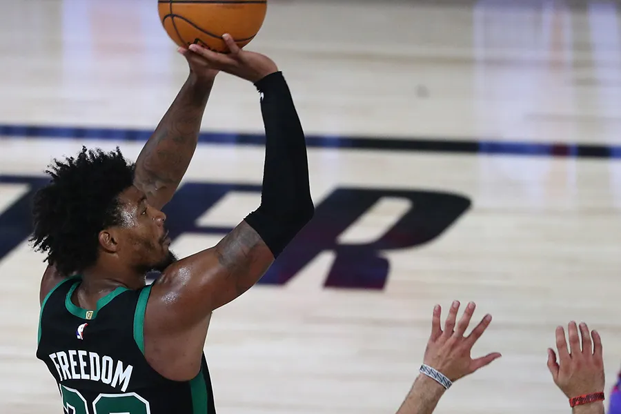 Sep 1, 2020; Lake Buena Vista, Florida, USA; Boston Celtics guard Marcus Smart (36) makes a three point basket over Toronto Raptors guard Fred VanVleet (23) during the second half of game two of the second round of the 2020 NBA Playoffs at ESPN Wide World of Sports Complex. Mandatory Credit: Kim Klement-USA TODAY Sports