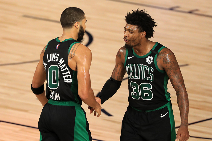 LAKE BUENA VISTA, FLORIDA - SEPTEMBER 01: Jayson Tatum #0 of the Boston Celtics and Marcus Smart #36 of the Boston Celtics react to a shot during the fourth quarter against the Toronto Raptors in Game Two of the Eastern Conference Second Round during the 2020 NBA Playoffs at The Field House at ESPN Wide World Of Sports Complex on September 01, 2020 in Lake Buena Vista, Florida. NOTE TO USER: User expressly acknowledges and agrees that, by downloading and or using this photograph, User is consenting to the terms and conditions of the Getty Images License Agreement. (Photo by Mike Ehrmann/Getty Images)