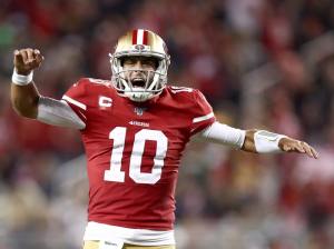 SANTA CLARA, CALIFORNIA - NOVEMBER 24: Jimmy Garoppolo #10 of the San Francisco 49ers celebrates after Raheem Mostert #31 ran in for a touchdown in the fourth quarter against the Green Bay Packers at Levi's Stadium on November 24, 2019 in Santa Clara, California. (Photo by Ezra Shaw/Getty Images)