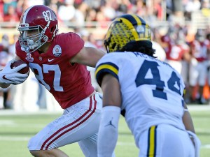 Jan 1, 2020; Orlando, Florida: Alabama Crimson Tide tight end Miller Forristall (87) runs for a touchdown past Michigan Wolverines linebacker Cameron McGrone (44) during the second half at Camping World Stadium. (Jasen Vinlove-USA TODAY)