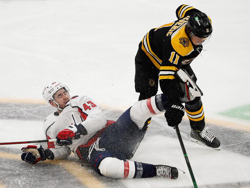 Mar 3, 2021; Boston, Massachusetts: Washington Capitals right wing Tom Wilson (43) is spilled by Boston Bruins center Trent Frederic (11) during the second period at TD Garden. (Winslow Townson-USA TODAY Sports)