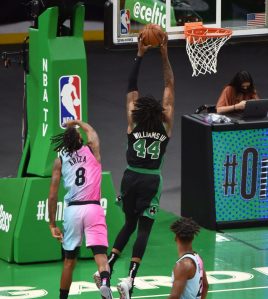 May 9, 2021; Boston, Massachusetts, USA; Boston Celtics center Robert Williams III (44) goes to the basket past Miami Heat forward Trevor Ariza (8) during the first half at TD Garden.