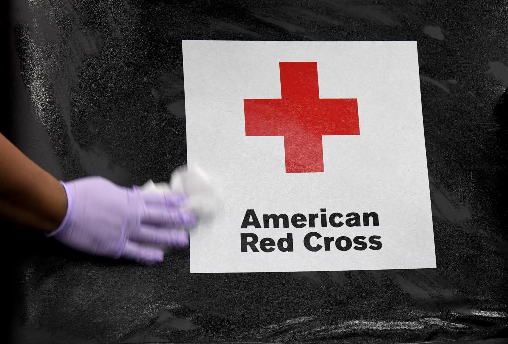 LAS VEGAS, NEVADA - MARCH 27: American Red Cross employee Darryl Thompson Jr. sanitizes a blood bed during an American Red Cross blood drive to help alleviate a blood supply shortage as a result of the coronavirus pandemic at Las Vegas Motor Speedway on March 27, 2020 in Las Vegas, Nevada. The speedway plans to hold a total of four blood drives due to a lack of donated blood and facilities large enough to collect it while observing social distancing guidelines. Many blood drives across the United States have been canceled as a result of the spread of the virus. The World Health Organization declared the coronavirus (COVID-19) a global pandemic on March 11th. (Photo by Ethan Miller/Getty Images)