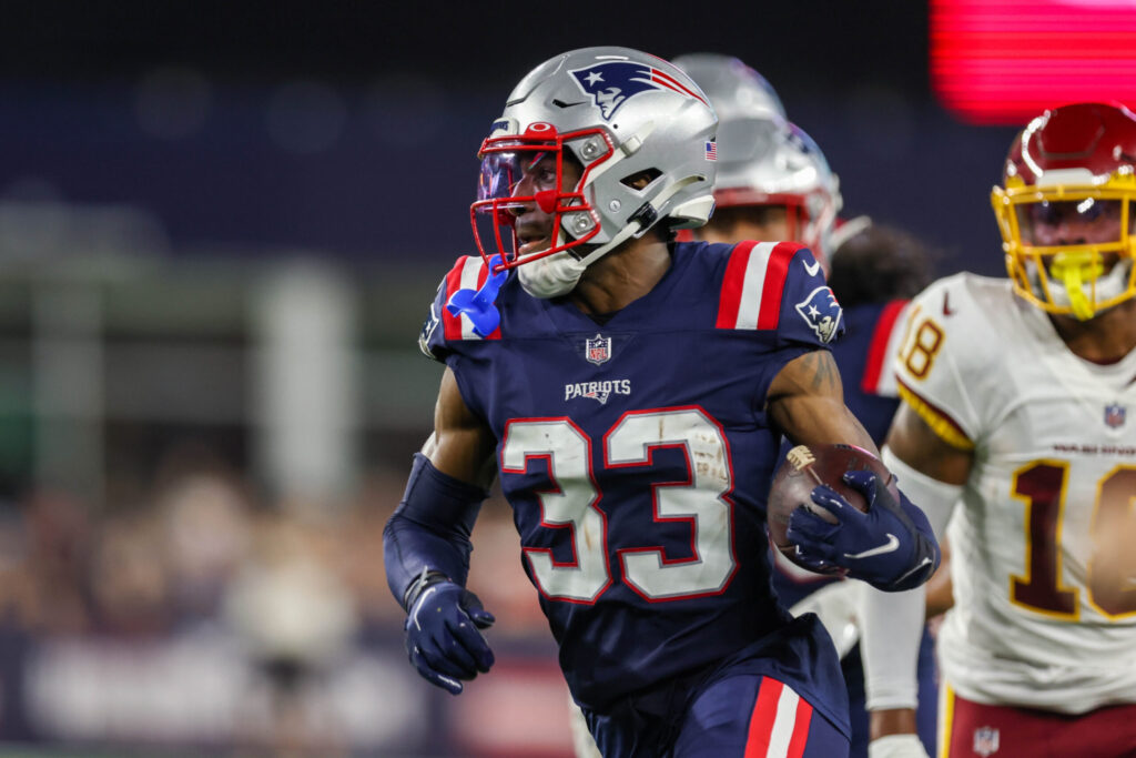 Aug 12, 2021; Foxborough, Massachusetts, USA; New England Patriots cornerback Joejuan Williams (33) runs the ball after intercepting a pass against the Washington Football Team during the second half at Gillette Stadium. Mandatory Credit: Paul Rutherford-USA TODAY Sports