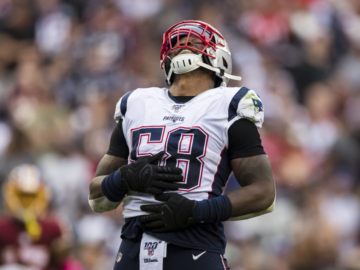 Jamie Collins #58 of the New England Patriots celebrates after causing Colt McCoy #12 of the Washington Redskins a to fumble the ball during the second half at FedExField on October 6, 2019 in Landover, Maryland. (Photo by Scott Taetsch/Getty Images)