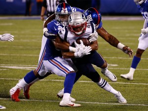 EAST RUTHERFORD, NJ - AUGUST 30: Grant Haley #34 of the New York Giants takes down Duke Dawson #42 of the New England Patriots during a preseason NFL game at MetLife Stadium on August 30, 2018 in East Rutherford, New Jersey. (Photo by Jeff Zelevansky/Getty Images)