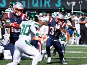 Sep 19, 2021; East Rutherford, New Jersey, USA; New England Patriots running back Damien Harris (37) carries the ball as New York Jets defensive end Bryce Huff (47) pursues during the second half at MetLife Stadium. Mandatory Credit: Vincent Carchietta-USA TODAY Sports