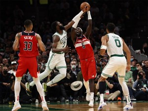 Oct 27, 2021; Boston, Massachusetts, USA; Washington Wizards center Montrezl Harrell (6) pulls a rebound away from Boston Celtics guard Jaylen Brown (7) during the second half at TD Garden. Mandatory Credit: Winslow Townson-USA TODAY Sports