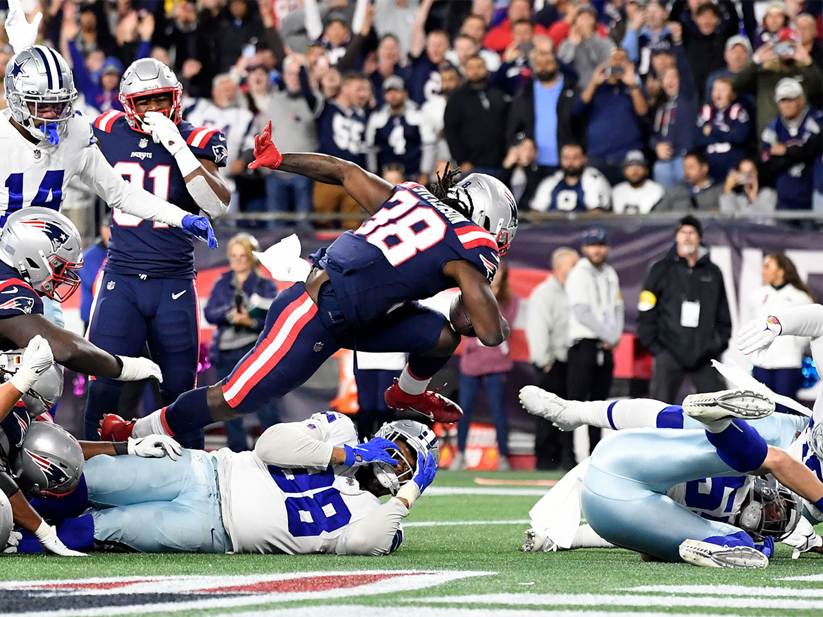Oct 17, 2021; Foxborough, Massachusetts, USA; New England Patriots running back Rhamondre Stevenson (38) scores a touchdown against the Dallas Cowboys during the second half at Gillette Stadium. Mandatory Credit: Brian Fluharty-USA TODAY Sports