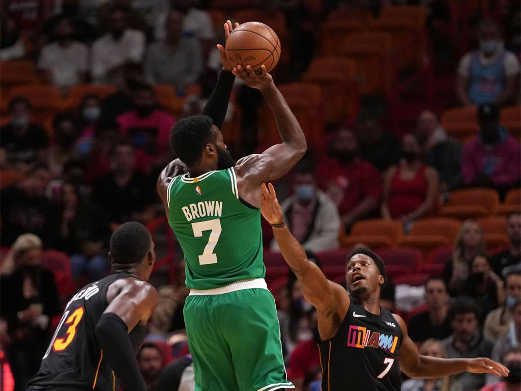 Nov 4, 2021; Miami, Florida, USA; Boston Celtics guard Jaylen Brown (7) shoots over Miami Heat guard Kyle Lowry (7) during the first half at FTX Arena. Mandatory Credit: Jasen Vinlove-USA TODAY Sports