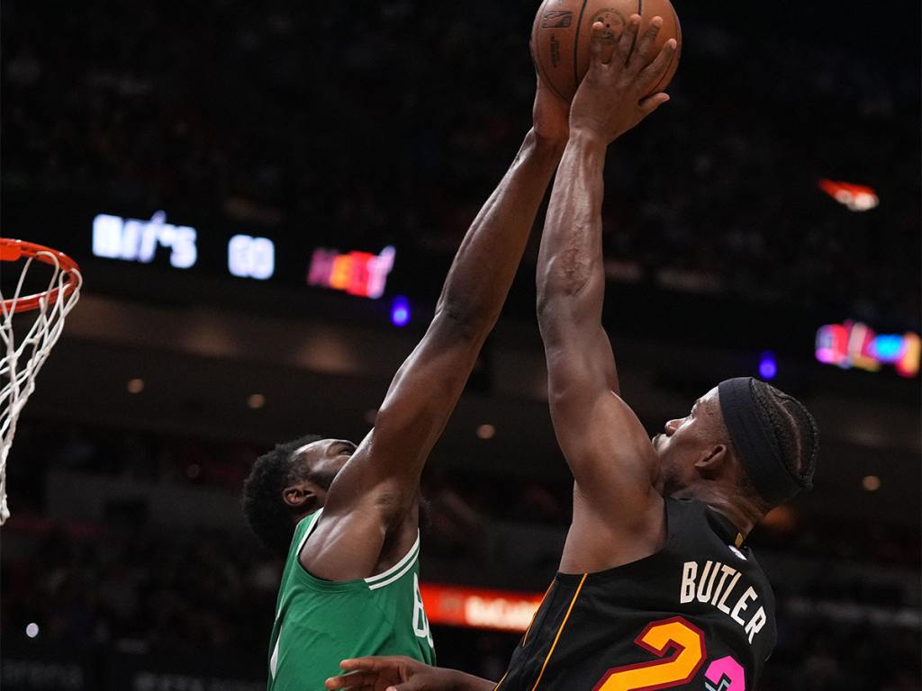 Nov 4, 2021; Miami, Florida, USA; Boston Celtics guard Jaylen Brown (7) blocks the shot of Miami Heat forward Jimmy Butler (22) during the first half at FTX Arena. Mandatory Credit: Jasen Vinlove-USA TODAY Sports