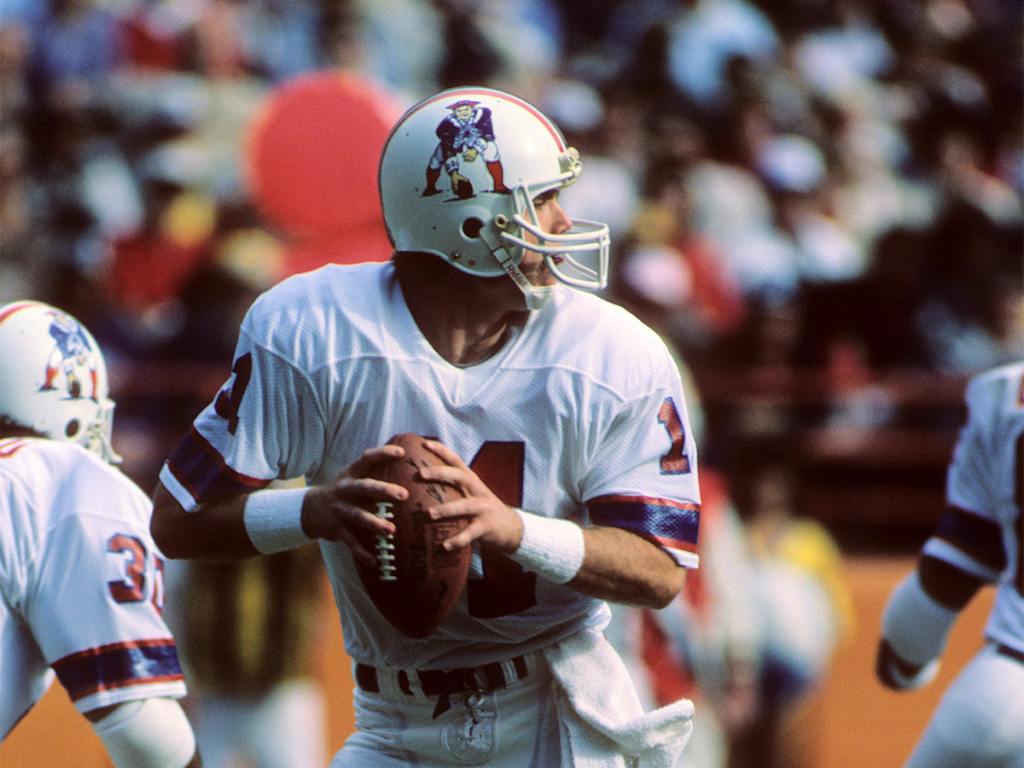 ANAHEIM, CA - DECEMBER 11: Tony Eason #11 of the New England Patriots drops back to pass during the game against the Los Angeles Rams at Anaheim Stadium on December 11, 1983 in Anaheim, California. The Patriots won 27-7. (Photo by George Rose/Getty Images)