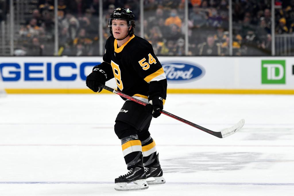 Dec 4, 2021; Boston, Massachusetts, USA; Boston Bruins defenseman Jack Ahcan (54) watches a play against the Tampa Bay Lightning during the first period at TD Garden. Mandatory Credit: Brian Fluharty-USA TODAY Sports