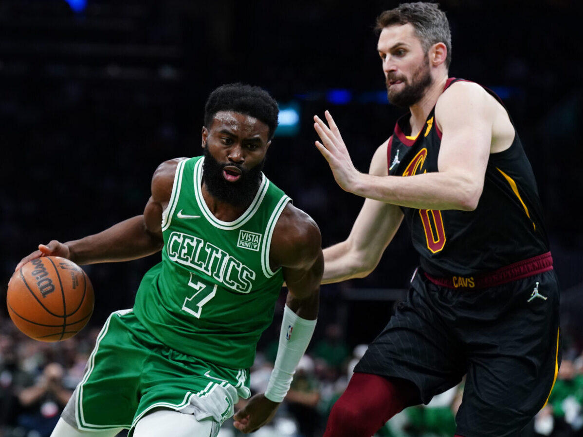 Boston Celtics' Jaylen Brown dunks over Cleveland Cavaliers