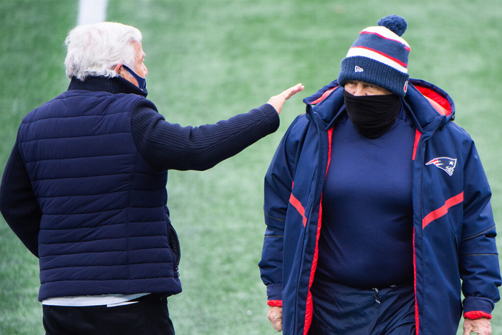 FOXBOROUGH, MA - JANUARY 3, 2021: New England Patriots owner Robert Kraft (L) pats head coach Bill Belichick on the shoulder during warmups prior to the start of the game against the New York Jets at Gillette Stadium on January 3, 2021 in Foxborough, Massachusetts. (Photo by Kathryn Riley/Getty Images)