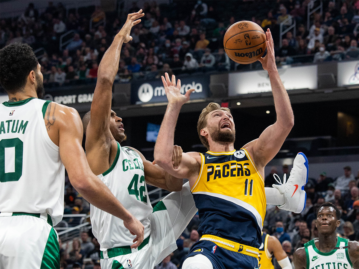 Jan 12, 2022; Indianapolis, Indiana, USA; Indiana Pacers forward Domantas Sabonis (11) shoots the ball while Boston Celtics center Al Horford (42) defends in the first half at Gainbridge Fieldhouse. Mandatory Credit: Trevor Ruszkowski-USA TODAY Sports