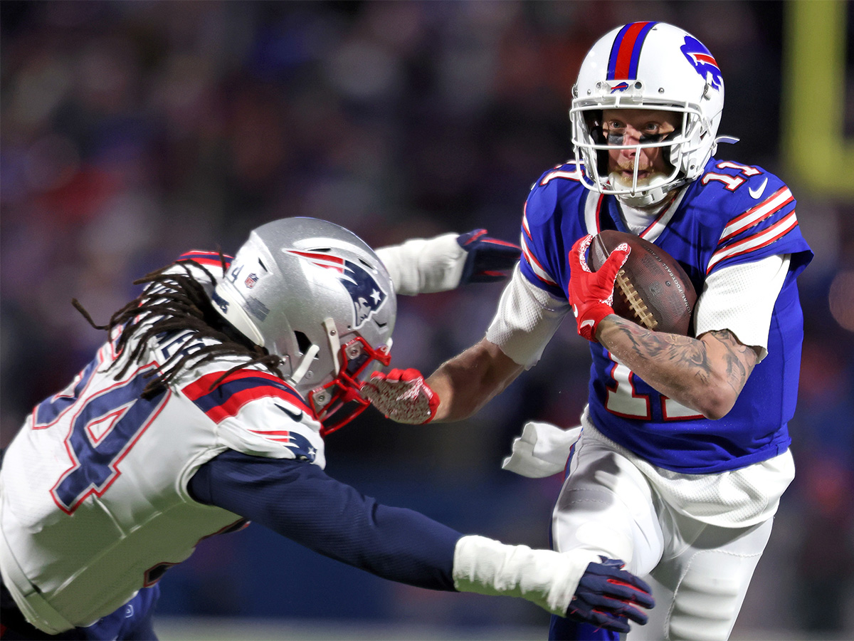 BUFFALO, NEW YORK - JANUARY 15: Cole Beasley #11 of the Buffalo Bills runs the ball against Dont'a Hightower #54 of the New England Patriots during the third quarter in the AFC Wild Card playoff game at Highmark Stadium on January 15, 2022 in Buffalo, New York. (Photo by Bryan M. Bennett/Getty Images)