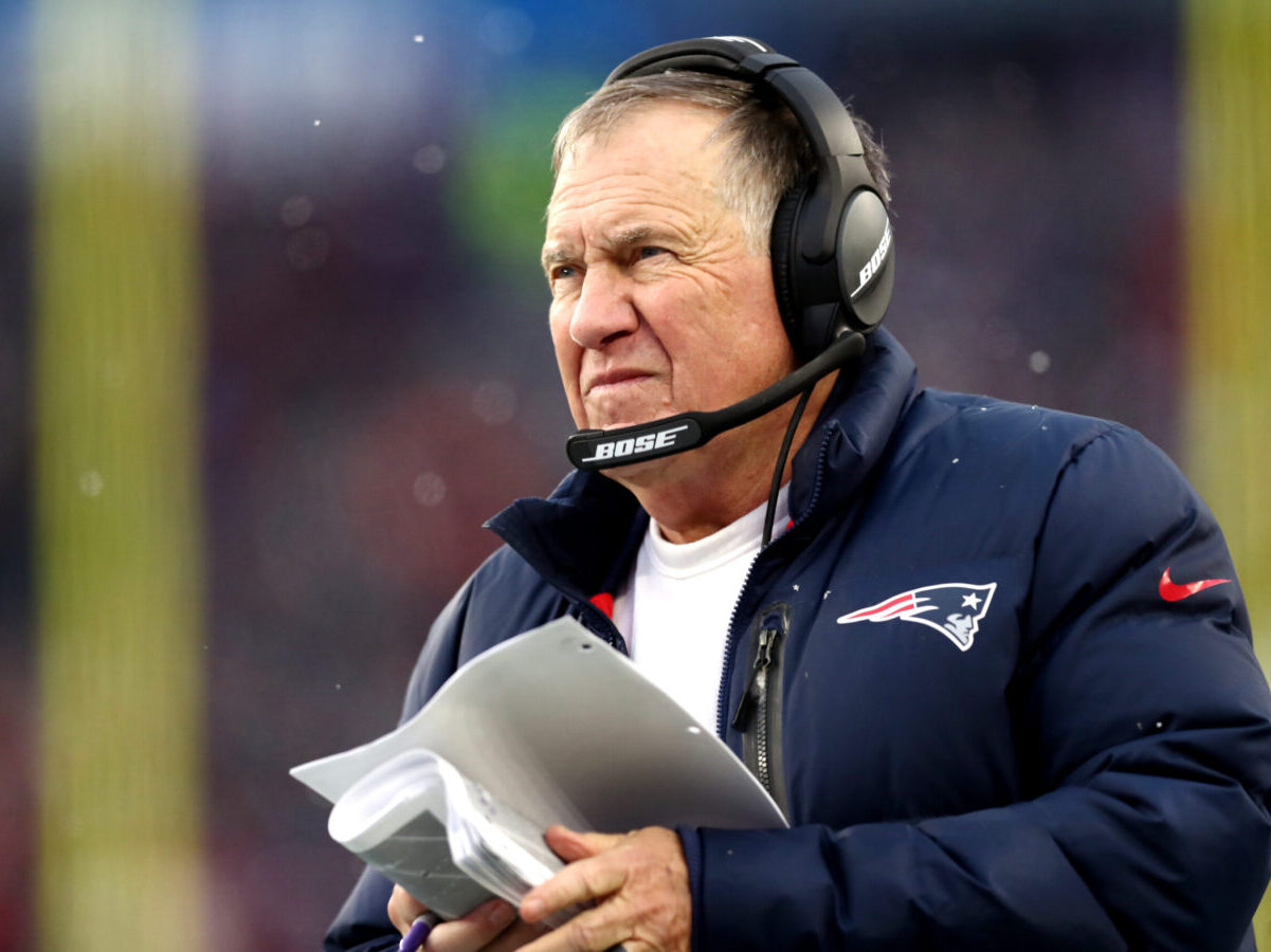 Head coach Bill Belichick of the New England Patriots looks on from the side line during the second half of the game against the Tennessee Titans at Gillette Stadium on November 28, 2021 in Foxborough, Massachusetts. (Photo by Adam Glanzman/Getty Images)